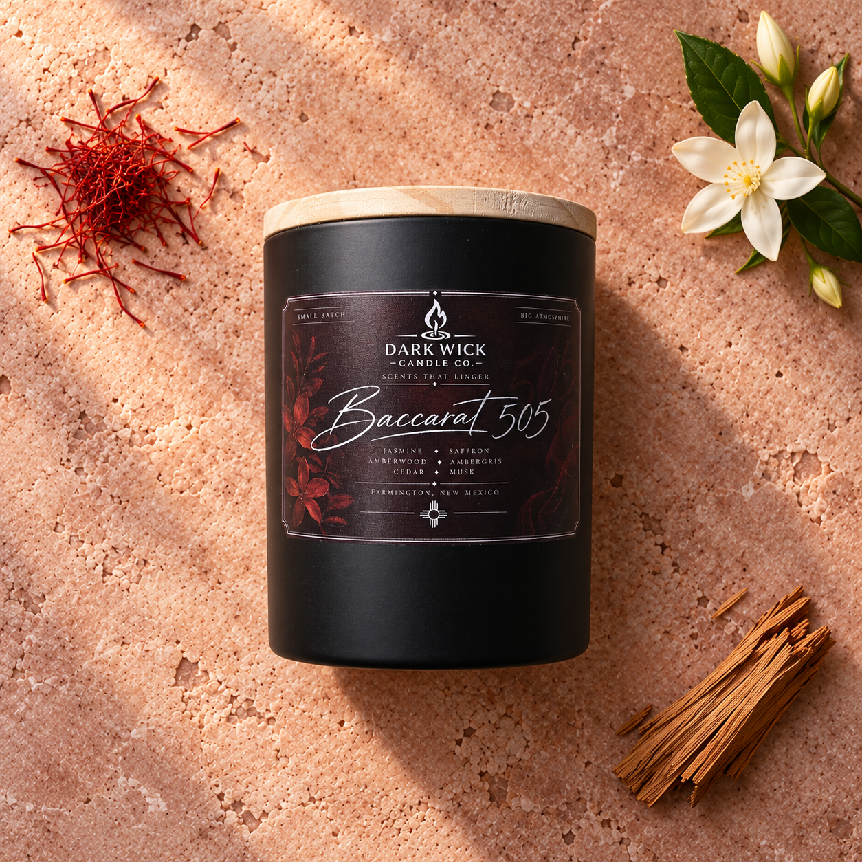 Existing flat lay of the small No. 505 candle with its earlier label, in a black vessel with a wooden lid.